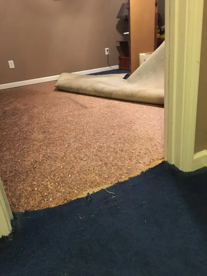 Carpet pad removal revealing water damage during Drying & Dehumidification in American Canyon